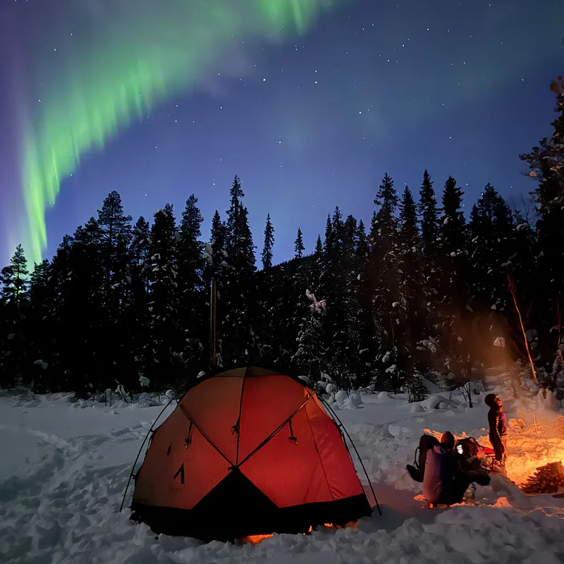 Tent camp under the northern lights near Kvikkjokk in early spring